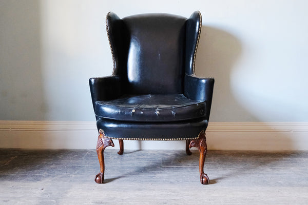 Black Leather-Upholstered Wingback Armchair with Ball & Claw Feet